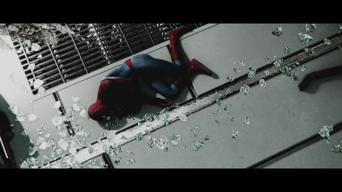 Spider-Man lying on a broken window