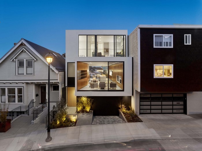 Modern house with large windows in a neighborhood