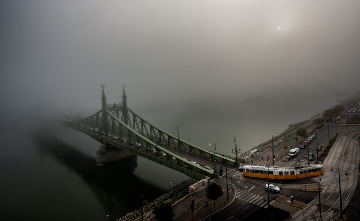 4K aerial view of Liberty Bridge in Budapest, Hungary during foggy weather