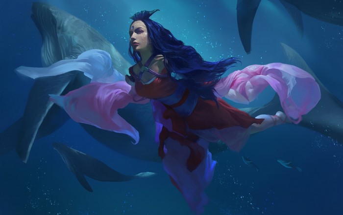 Woman with blue hair swimming with whales