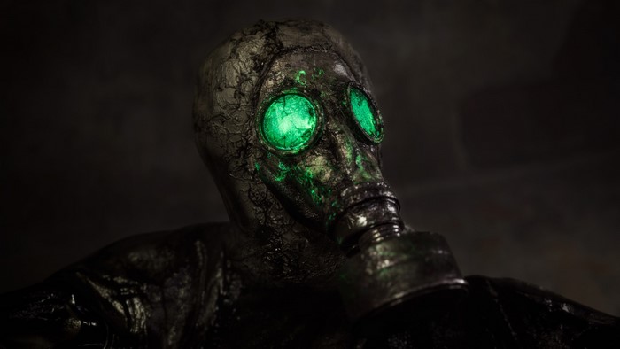 Gas mask with glowing green eyes