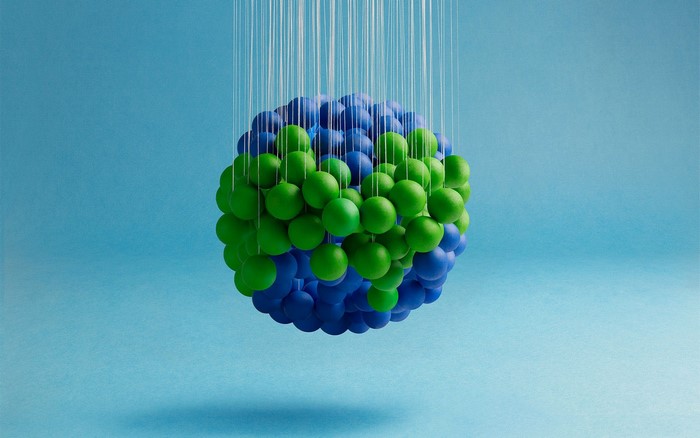 Sphere of blue and green balls hanging from strings