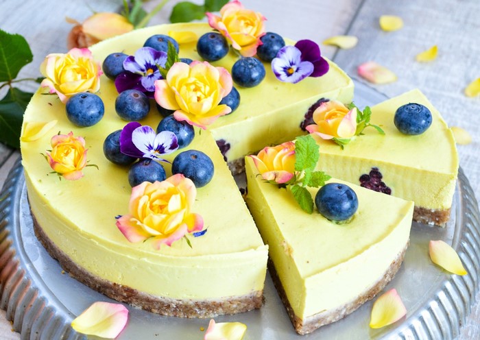 Yellow cake with blueberries and flowers