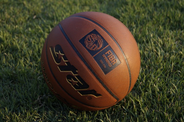 Basketball on grass with FIBA approved logo