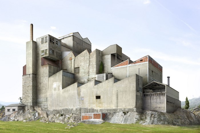 Concrete industrial building complex on a rocky hill