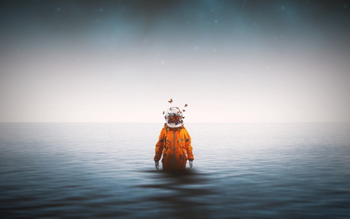 Astronaut in the sea with butterflies