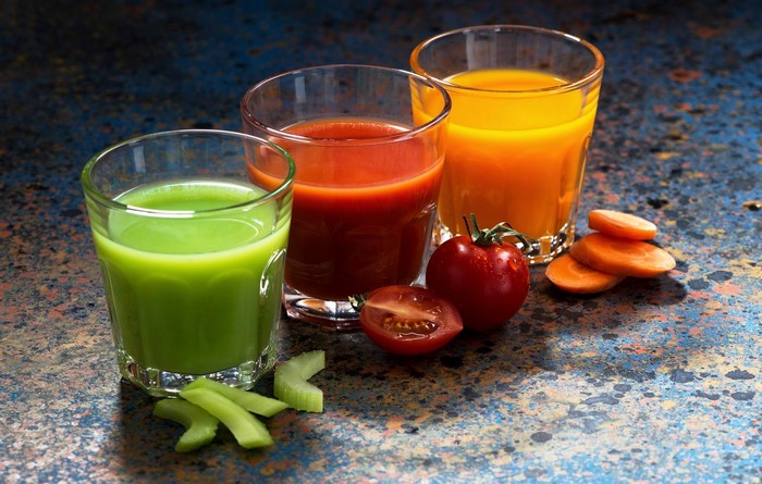 Three glasses of juice with vegetables