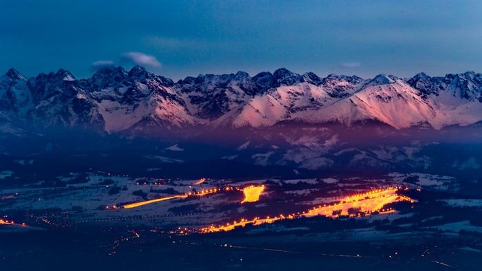 Snowy Tatra Mountains at Dusk with Ski Resort Lights