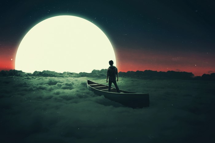 Man in a boat on clouds with large moon