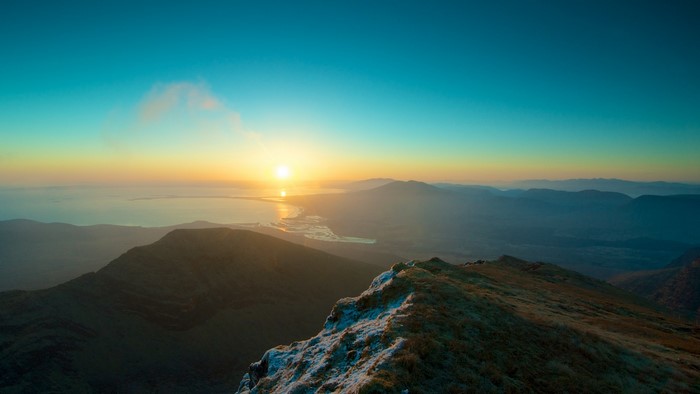 Sunset over mountains and bay