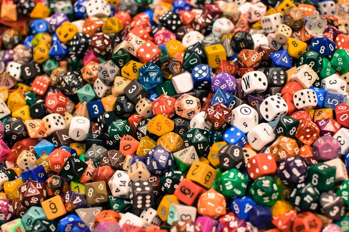A large pile of colorful polyhedral dice