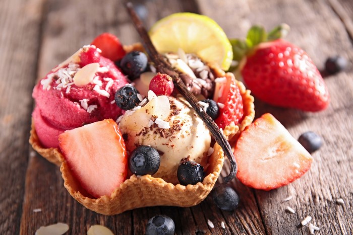 Ice cream sundae with strawberries and blueberries