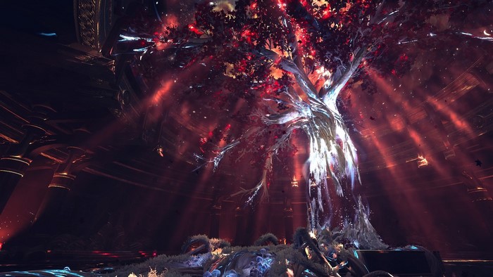 Tree with red leaves in a dark, ornate room