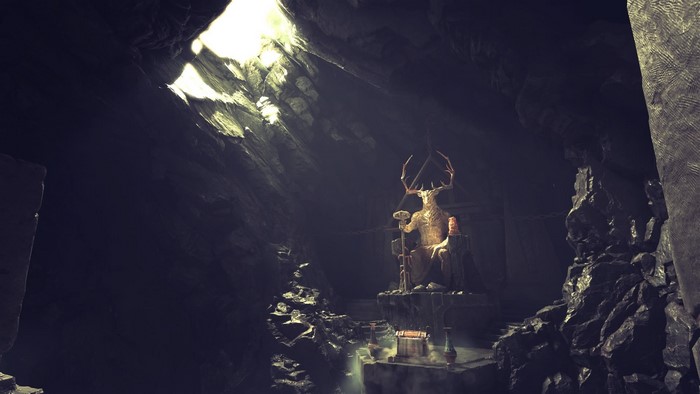 Statue of a deer-headed figure in a cave from God of War