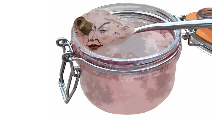 Jar of pink paste with a face and a bullet