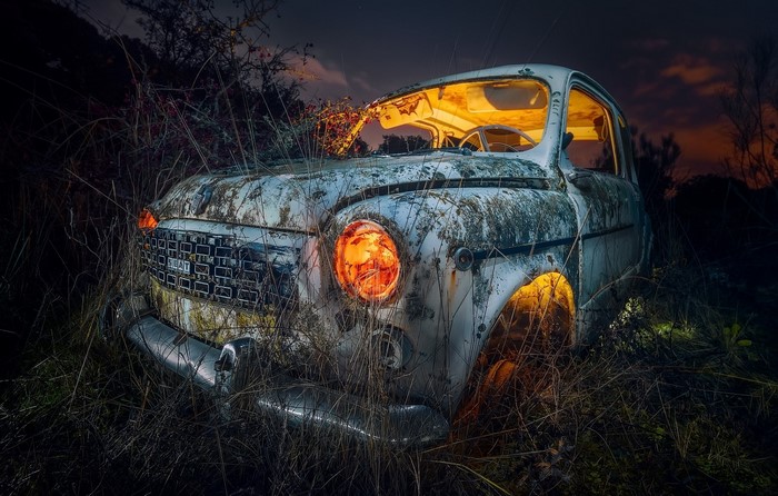 Abandoned Fiat car at night