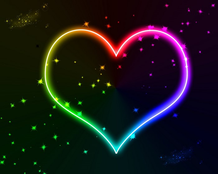 Rainbow neon heart with stars on black background