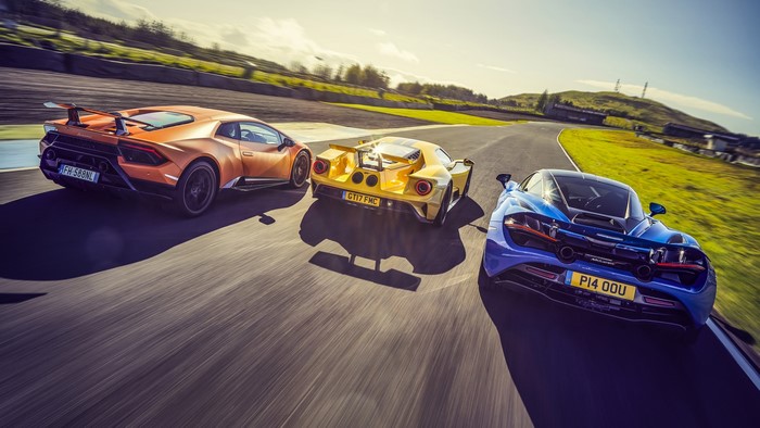 Lamborghini Huracan, Ford GT, and McLaren 720S on a race track