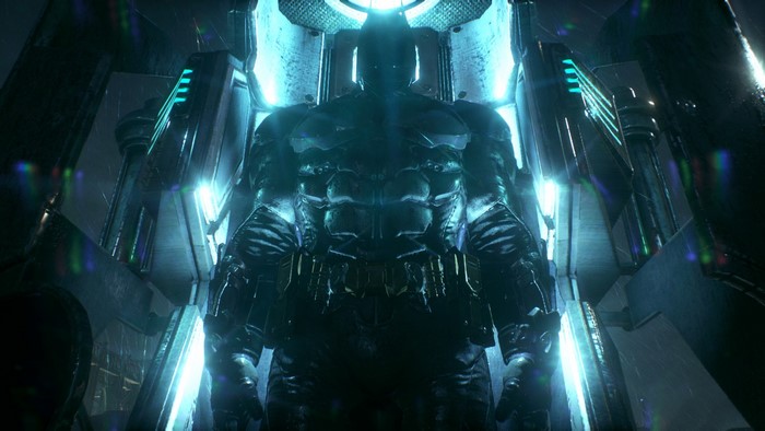 Batman in a blue illuminated chamber