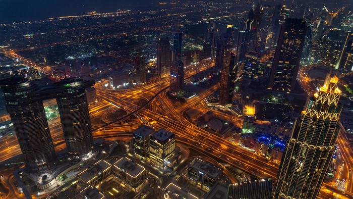4K Dubai cityscape with traffic at night