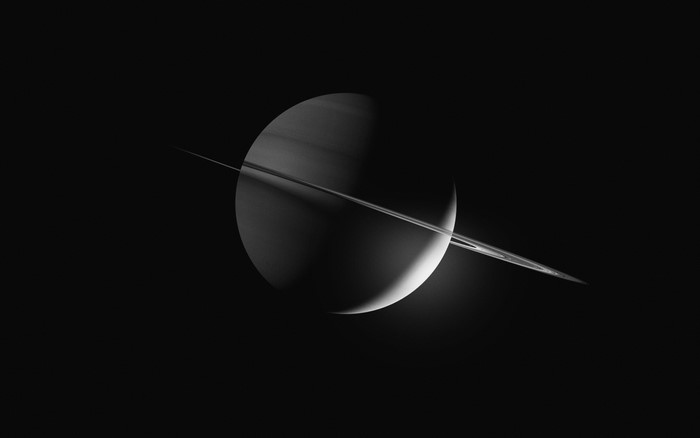 Saturn and its rings in space
