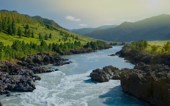 River flowing through mountains and rocky shores