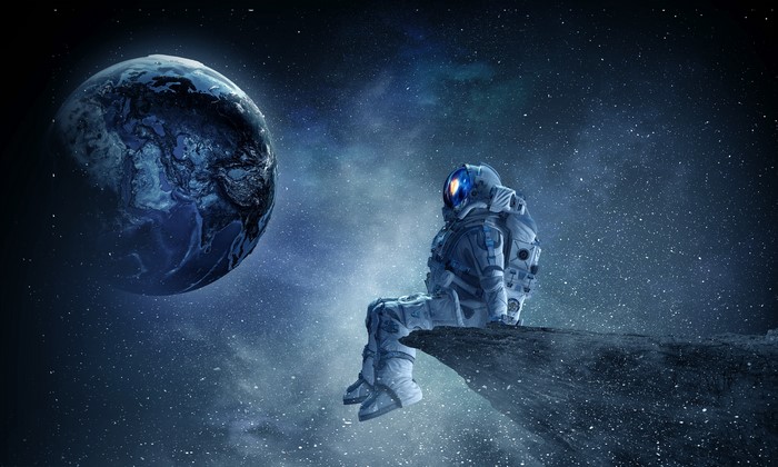 4K Astronaut Sitting on Cliff Near Earth