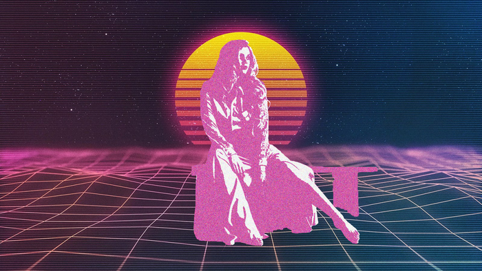 Woman sitting in front of a retro sunset
