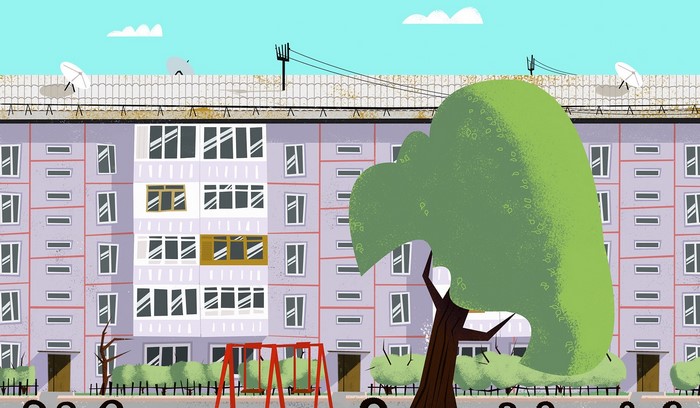 Apartment building with playground and tree