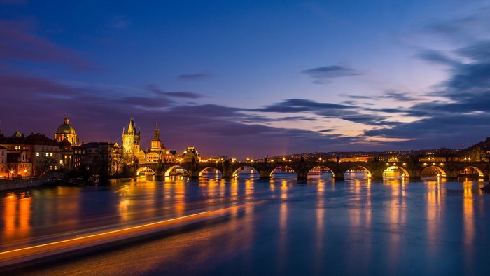 Charles Bridge at dusk over the Vltava River in Prague