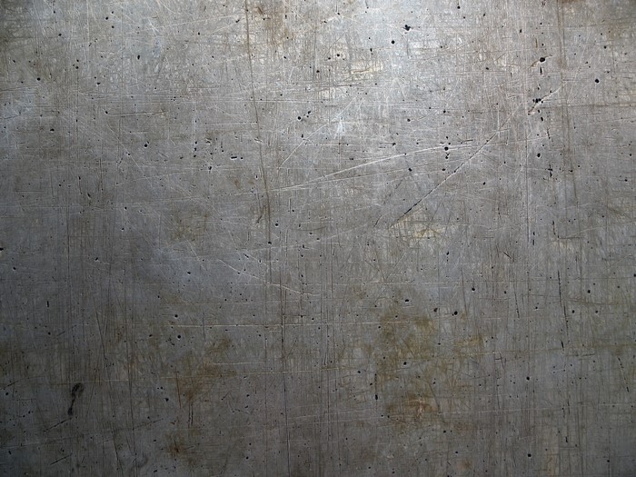 Scratched metal texture with small holes