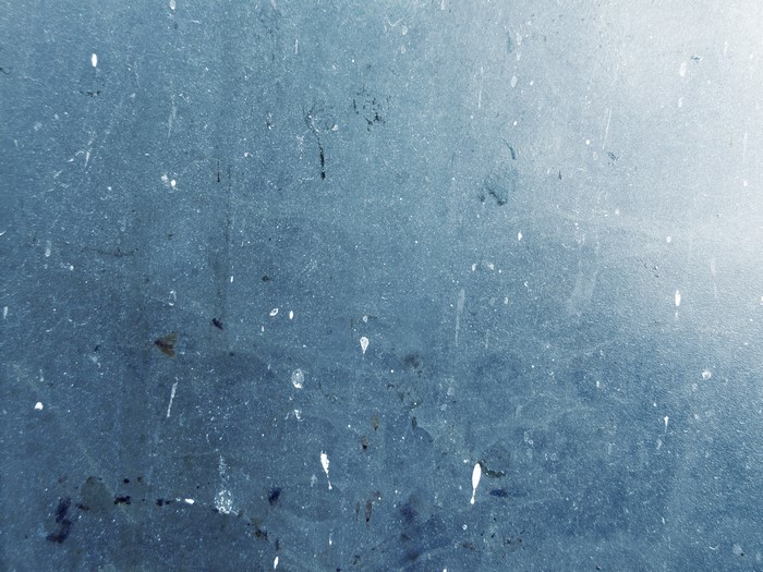 Blue textured surface with white speckles