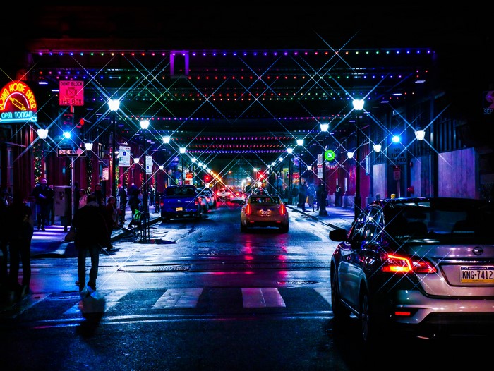 Night street with neon lights and cars in Pennsylvania