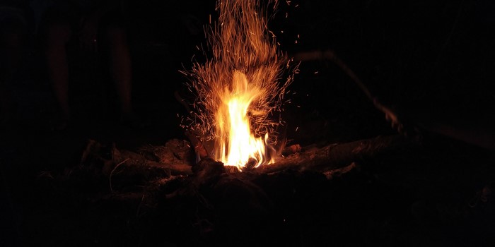 Campfire with sparks at night