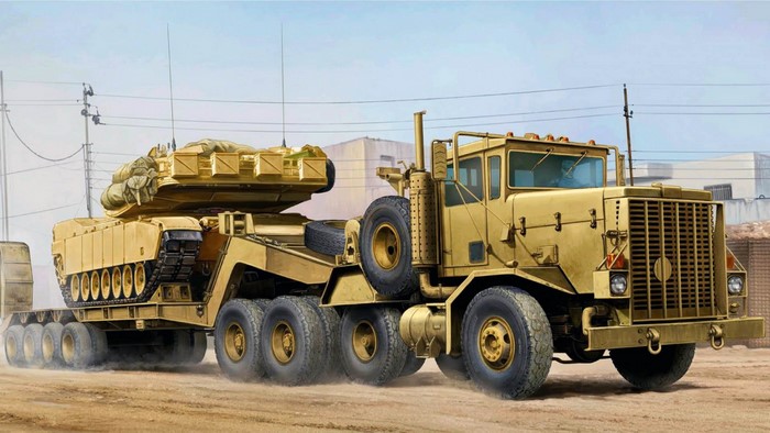 Military truck transporting a tank