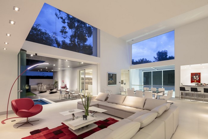 Modern living room with large windows and outdoor patio