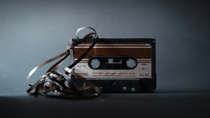Vintage audio cassette tape with tangled ribbon