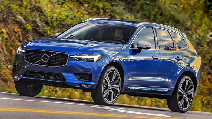 Blue Volvo XC60 driving on a road