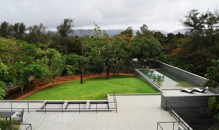 Modern house with swimming pool and trees