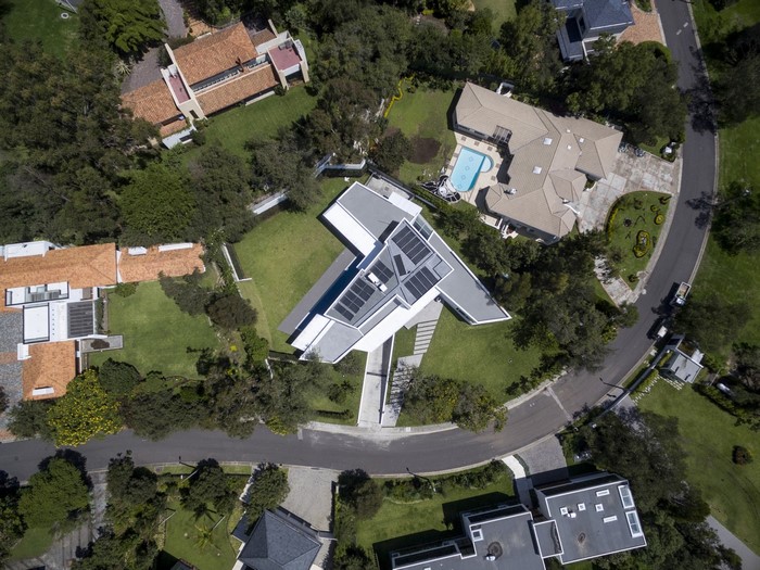 Aerial view of modern houses with solar panels