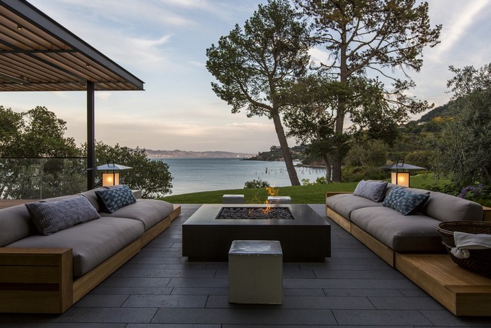 Outdoor patio with fire pit and bay view