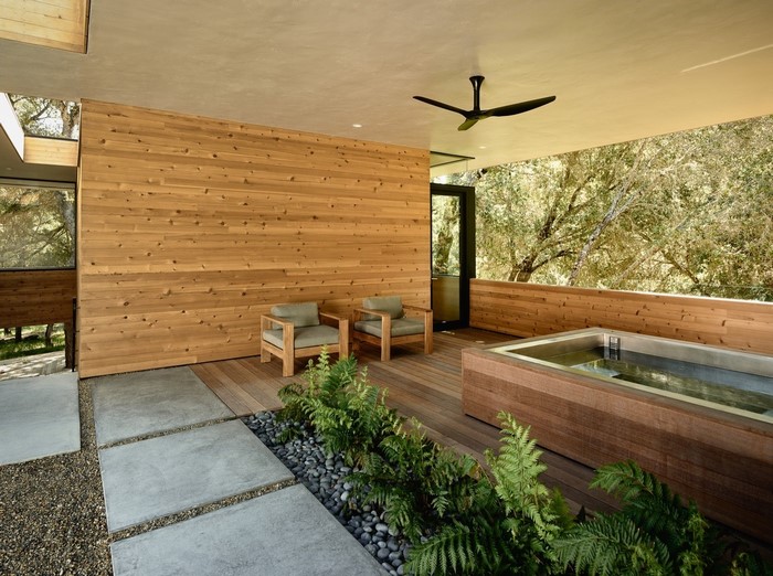 Modern wooden deck with hot tub and seating