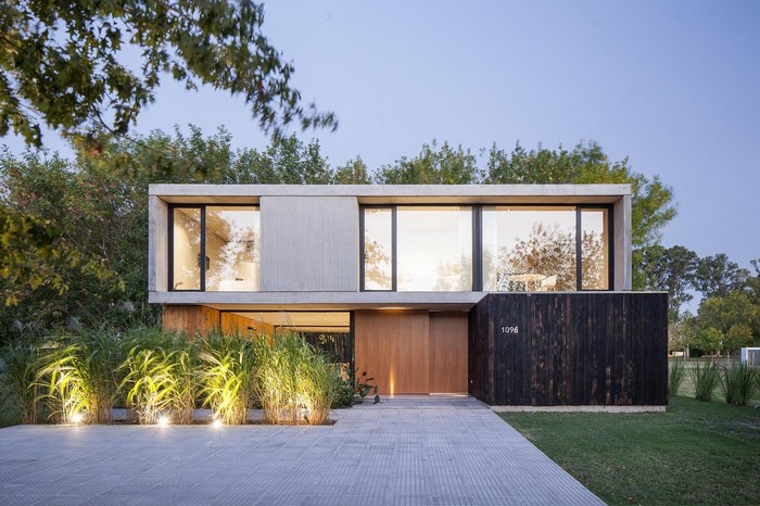 Modern concrete and wood house with large windows