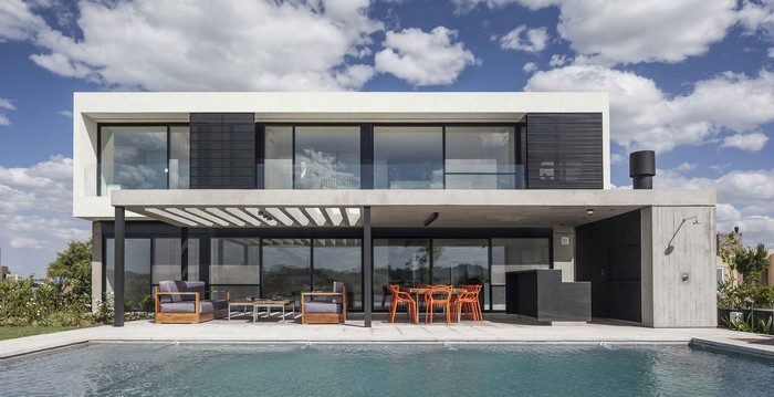 Modern house with swimming pool and outdoor dining area