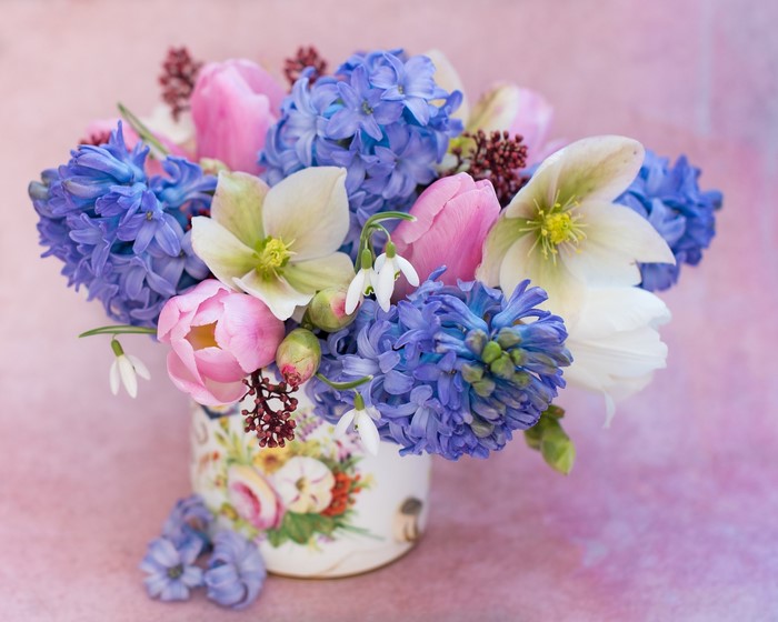 Spring flower arrangement in a decorative vase