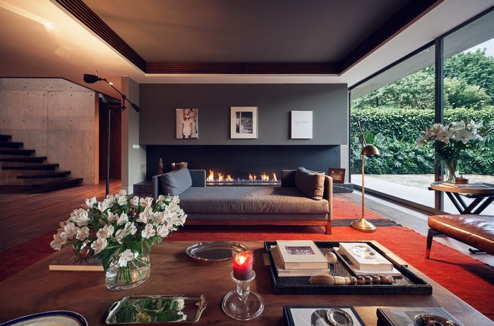 Modern living room with fireplace and large window