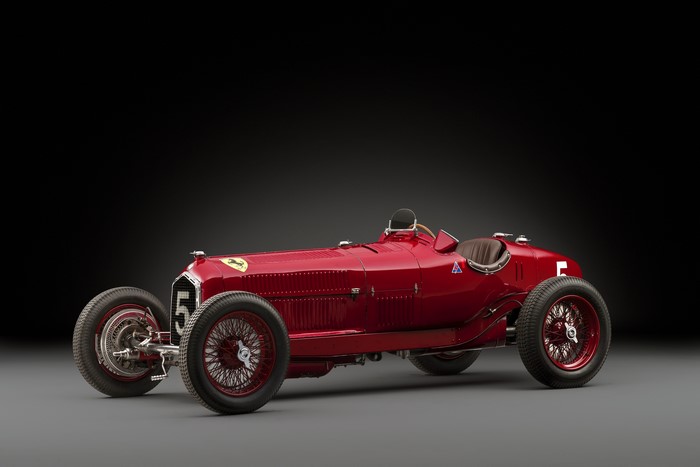 Red Alfa Romeo Grand Prix race car with number 5