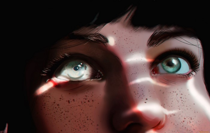 Close-up of a woman's face with freckles and green eyes