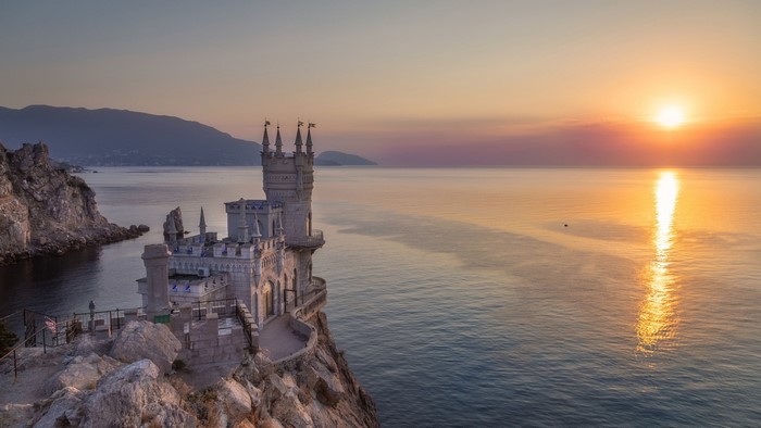 Swallow's Nest castle on a cliff overlooking the sea at sunset