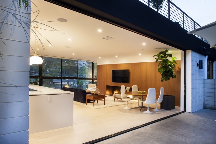 Modern living room with fireplace and dining area